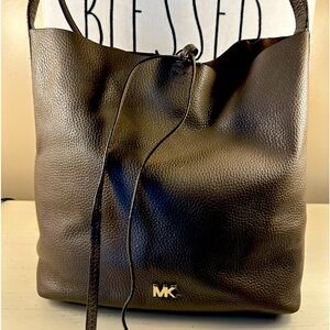 Michael Kors black leather tote with ties and snap closure
